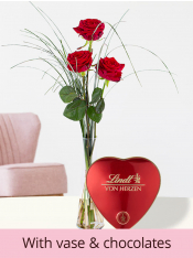 Three red premium roses, including glassvase and Lindt