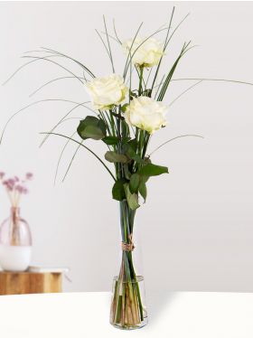 Three white roses including vase