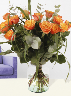Bouquet of orange roses with panicum and eucalyptus