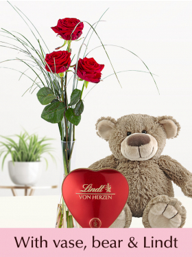 Three red roses including teddybear, vase and Lindt heart
