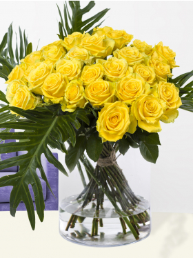 30 yellow roses with botanical leaves